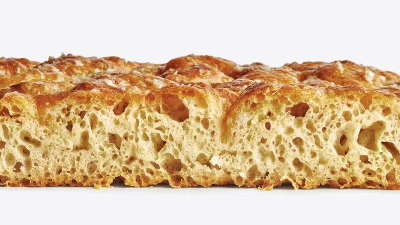 Article from www.bonappetit.com with the title Shockingly Easy No-Knead Focaccia